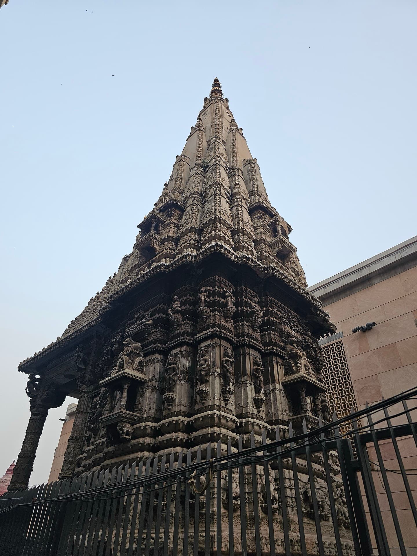 A carved stone temple shikhara in the Kashi Vishwanath Dham complex, Varanasi